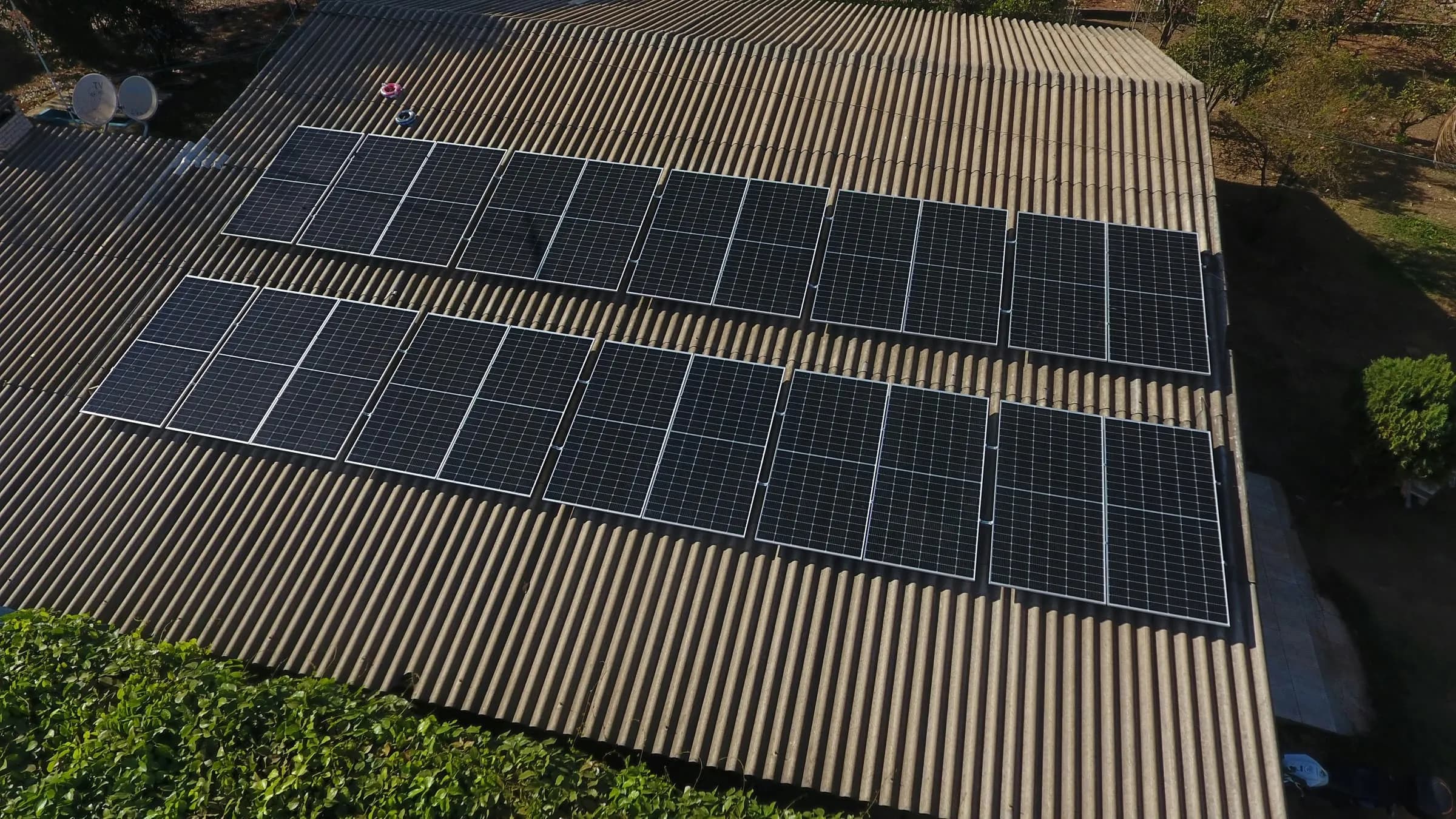 Rows of solar panels on a large commercial rooftop